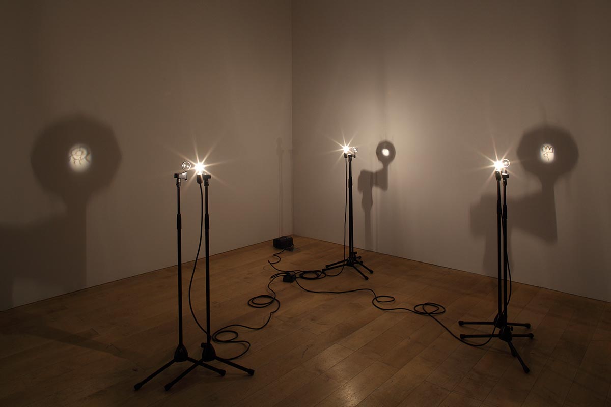 “Light Symbol”, 2012. Engraving on light bulb, magnifier, microphone stand. Photo by Keizo Kioku. Courtesy of Ota Fine Arts.